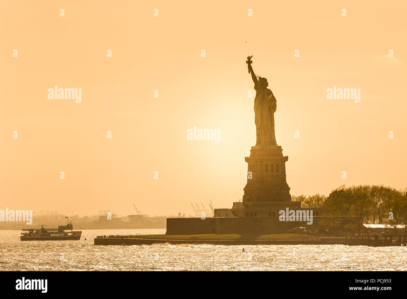 Statue of Liberty silhouette in sunset, New York City, USA Stock Photo ...