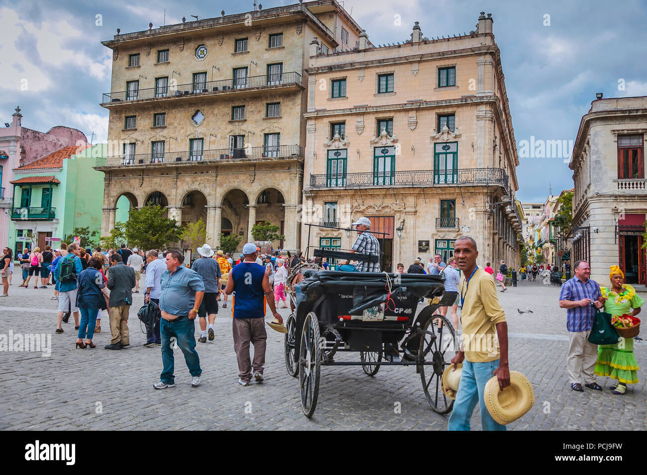 Horse carriage and tourist crowd - Havana, Cuba Stock Photo