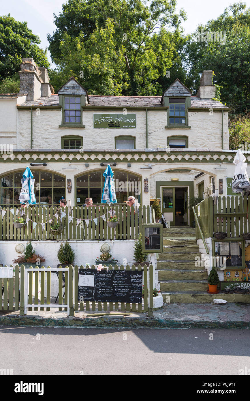 People dining al fresco on a sunny summer day at the Harbour Green House restaurant, in Fore