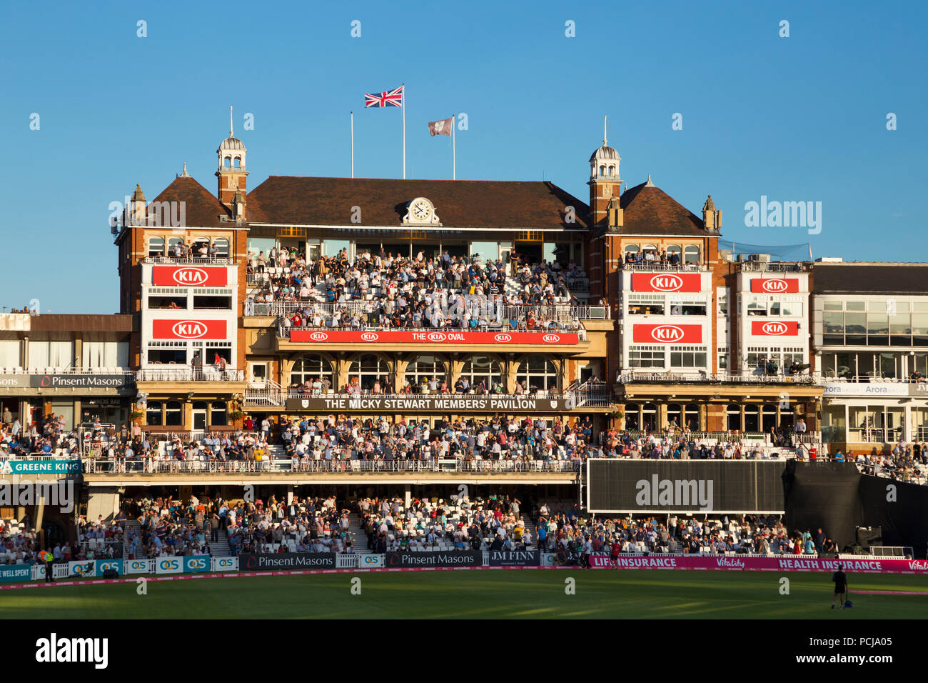 The Micky Stewart Members' Pavilion overlooking 20 20 day night match and the cricket pitch / wicket of The Oval cricket ground (The Kia Oval) Vauxhall, London. UK. (100) Stock Photo