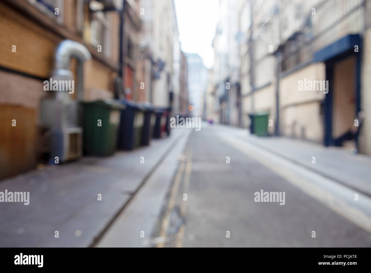 Blurred View Of London Dirty Back Street With Shops Trash Cans And Buildings Can Be Used As Background Stock Photo Alamy