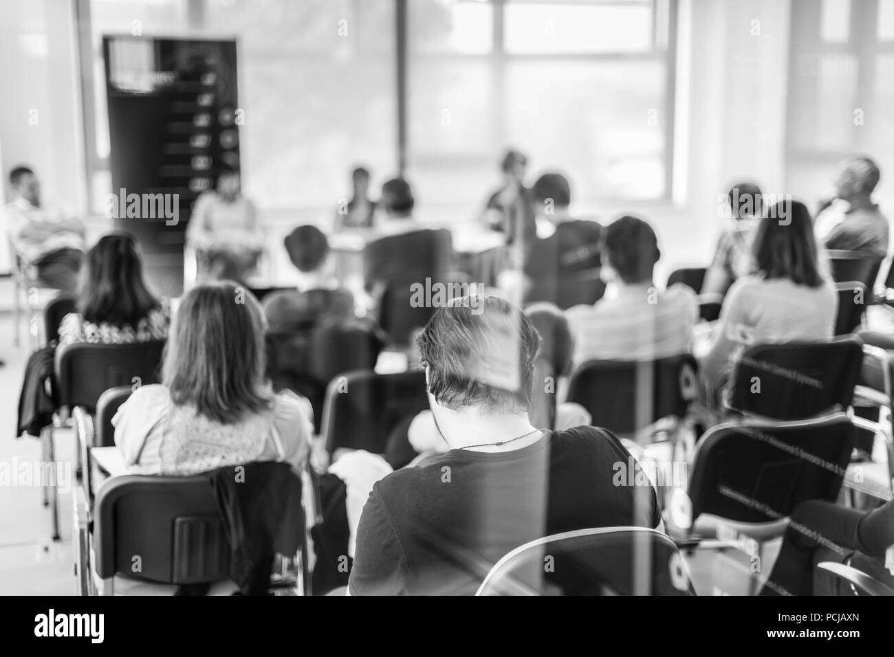 Round table discussion at Business convention and Presentation. Audience at the conference hall. Business and entrepreneurship symposium. Black and wh Stock Photo