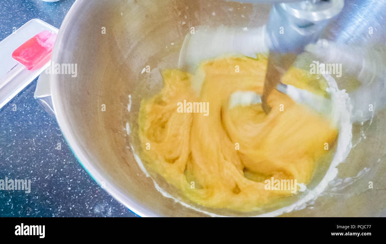 Step by step. Mixing ingredients in kitchen mixer to make vanilla