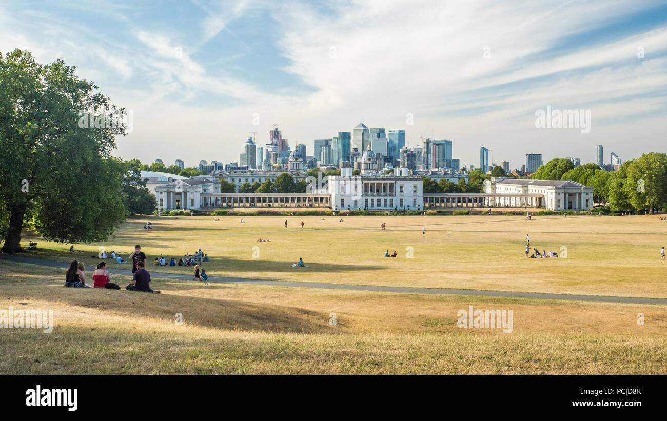 View from Greenwich Park towards the University (Old Royal Naval College) with the Skyscrapers of Canary Wharf  behind. Stock Photo