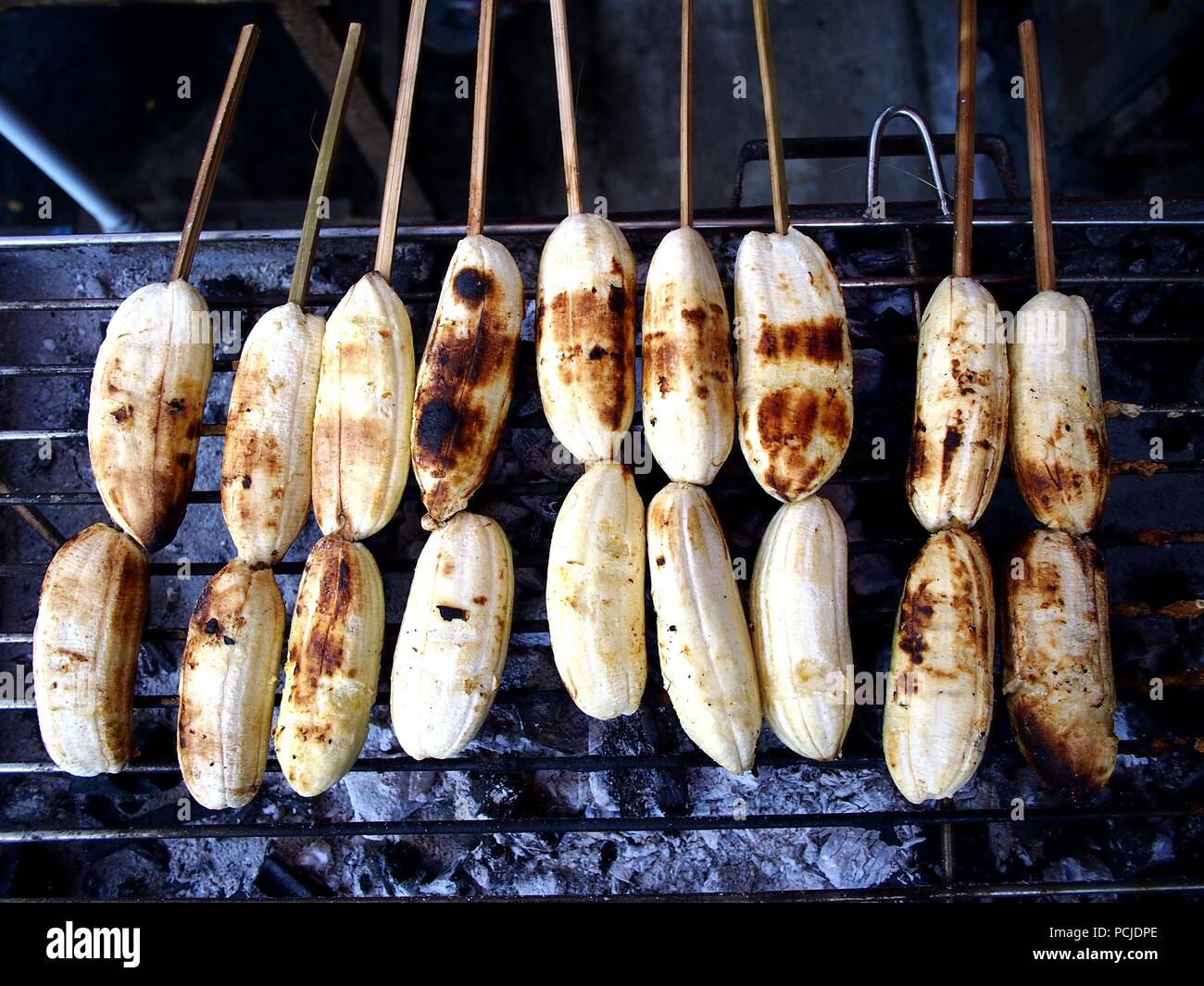 Photo of grilled saba banana or fat banana on stick Stock Photo