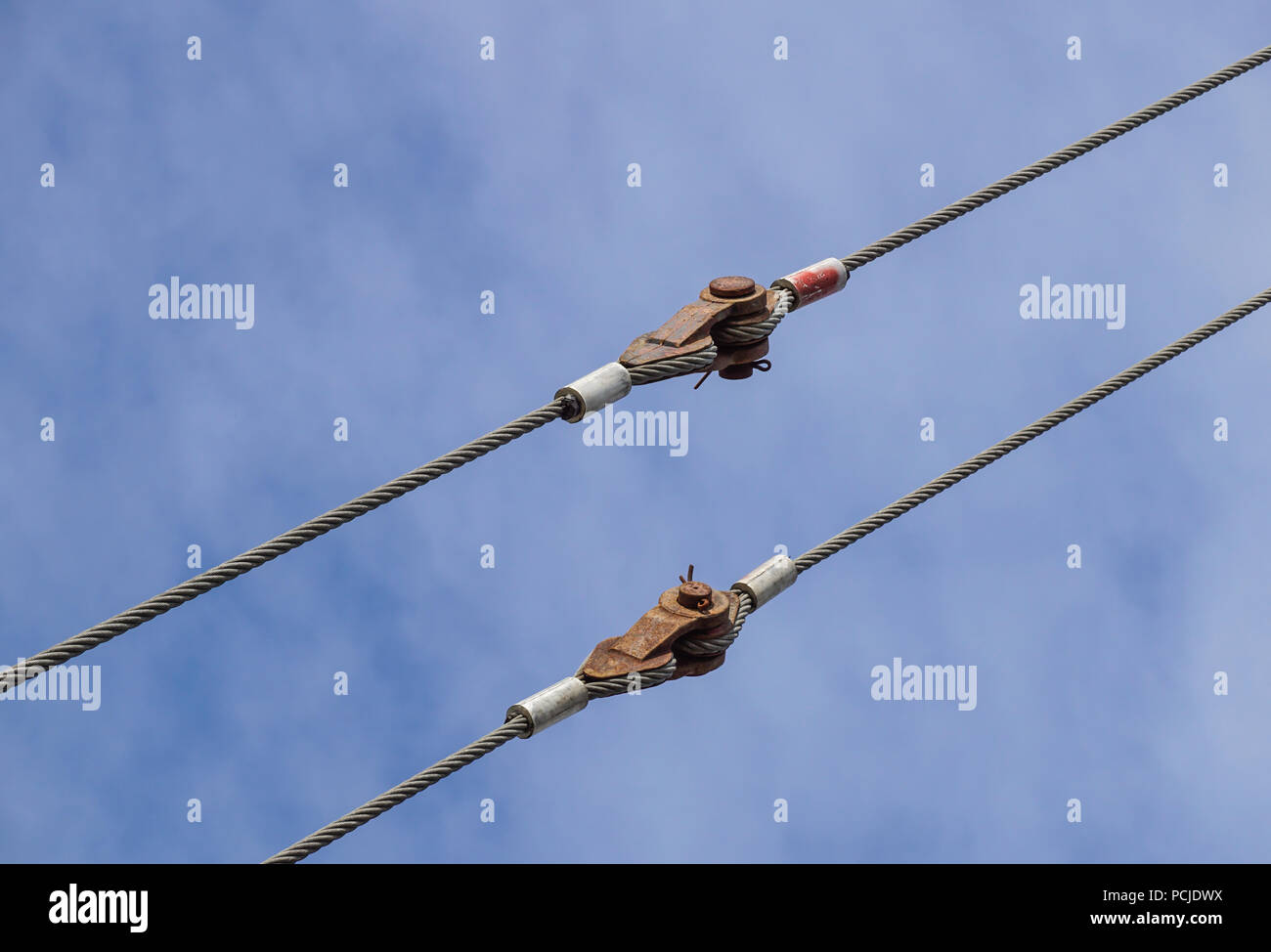 Big harbor cranes hooks hanging on steel ropes Stock Photo Alamy