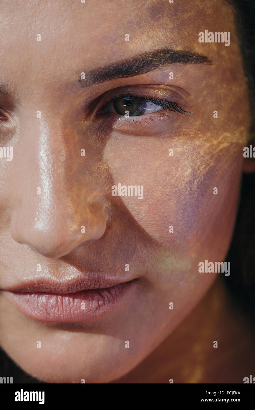 Close-up of sunlight on a woman's face Stock Photo