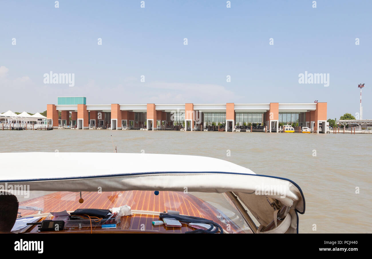 Water taxi approaching the docking area at Marco Polo Airport, Venice, Veneto, Italy in a first person POV during an airport transfer from a Venetian  Stock Photo