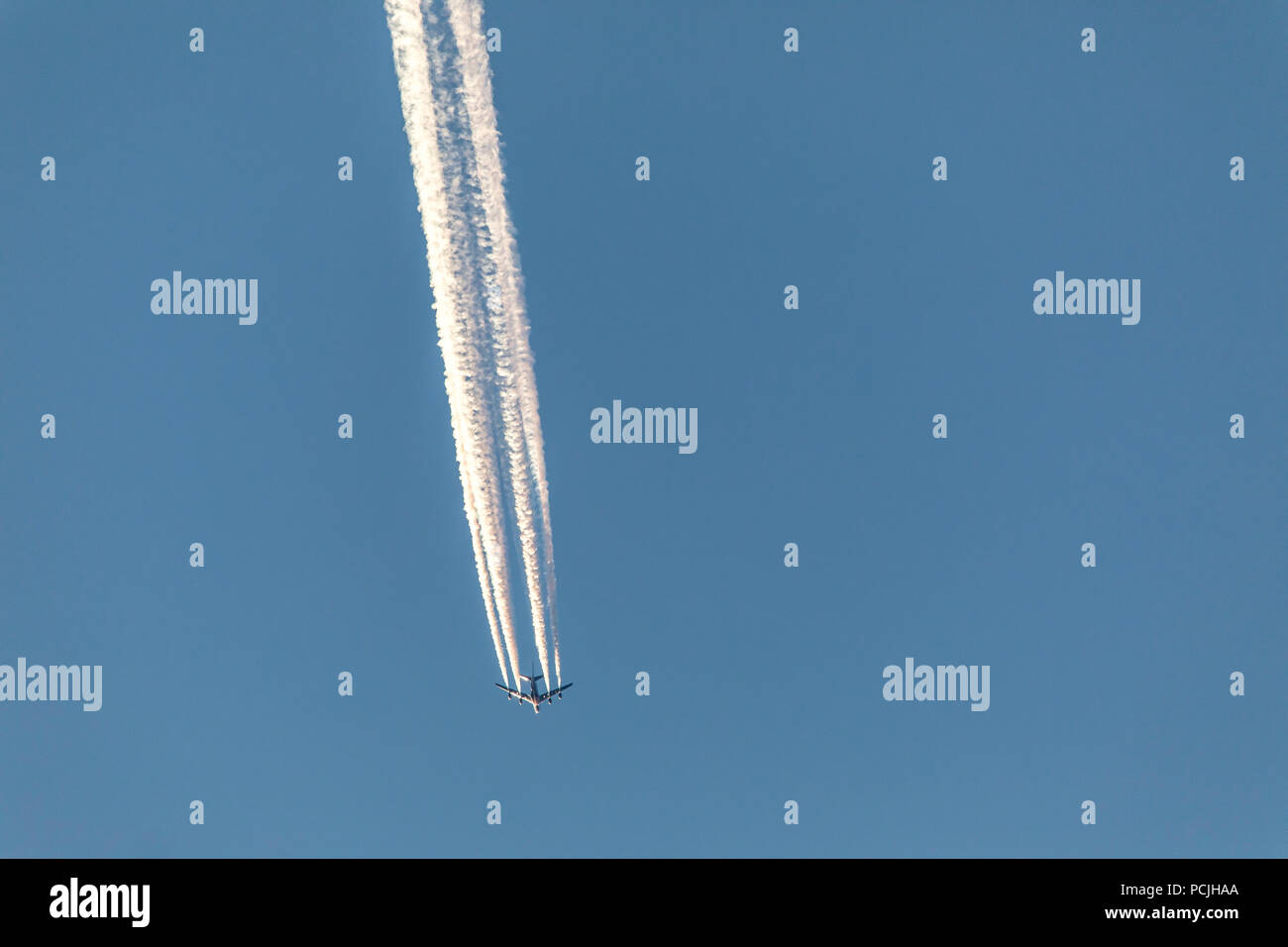 Airplane, jet, four-engine, Boeing 747, jumbo jet, in the sky, contrails, Stock Photo