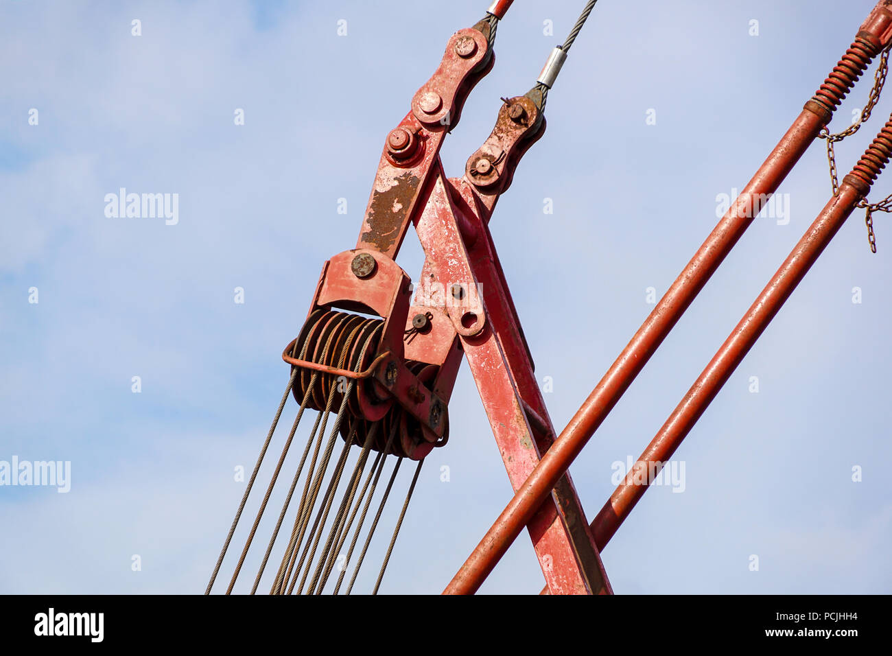 Big harbor cranes hooks hanging on steel ropes Stock Photo Alamy