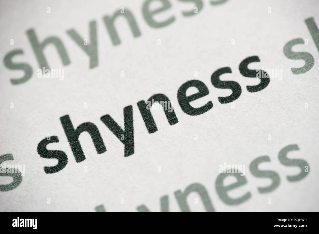 word shyness printed on white paper macro Stock Photo