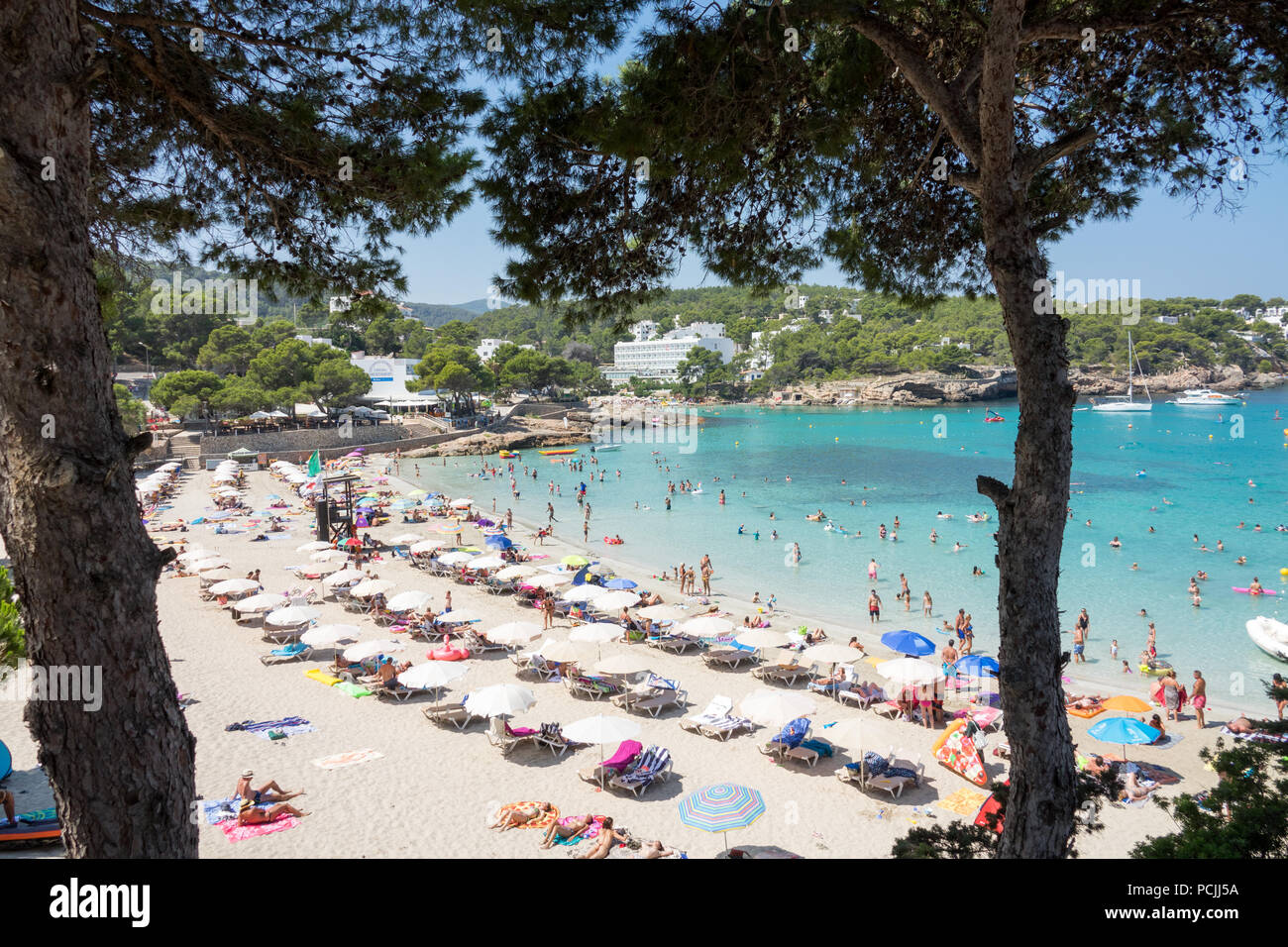 Visitors and holidaymakers in Portinatx in ibiza, Spain Stock Photo - Alamy
