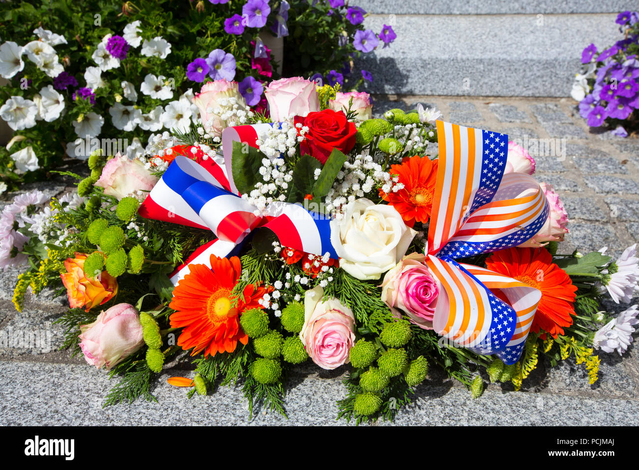 Flowers lying on a memorial to American soldiers who died following the ...