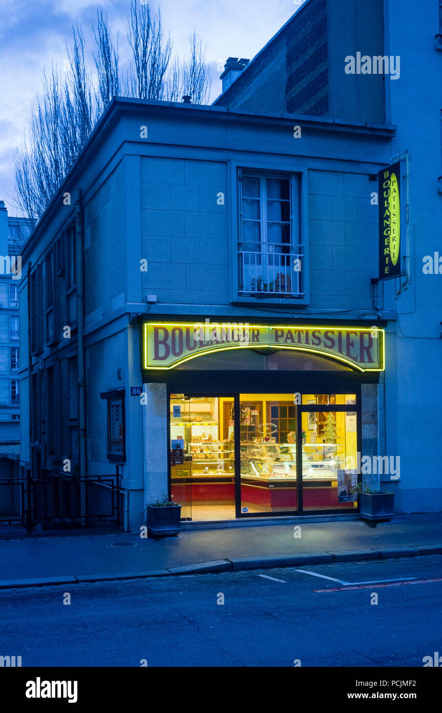 Traditional boulangerie patisserie at dusk in Le Havre, Normandy, France Stock Photo