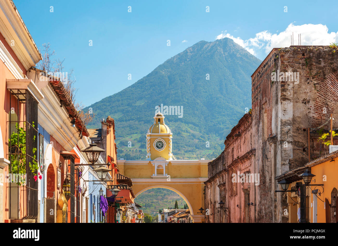 Antigua Guatemala, classic colonial town with famous Arco de Santa Catalina and Volcan de Agua behind Stock Photo