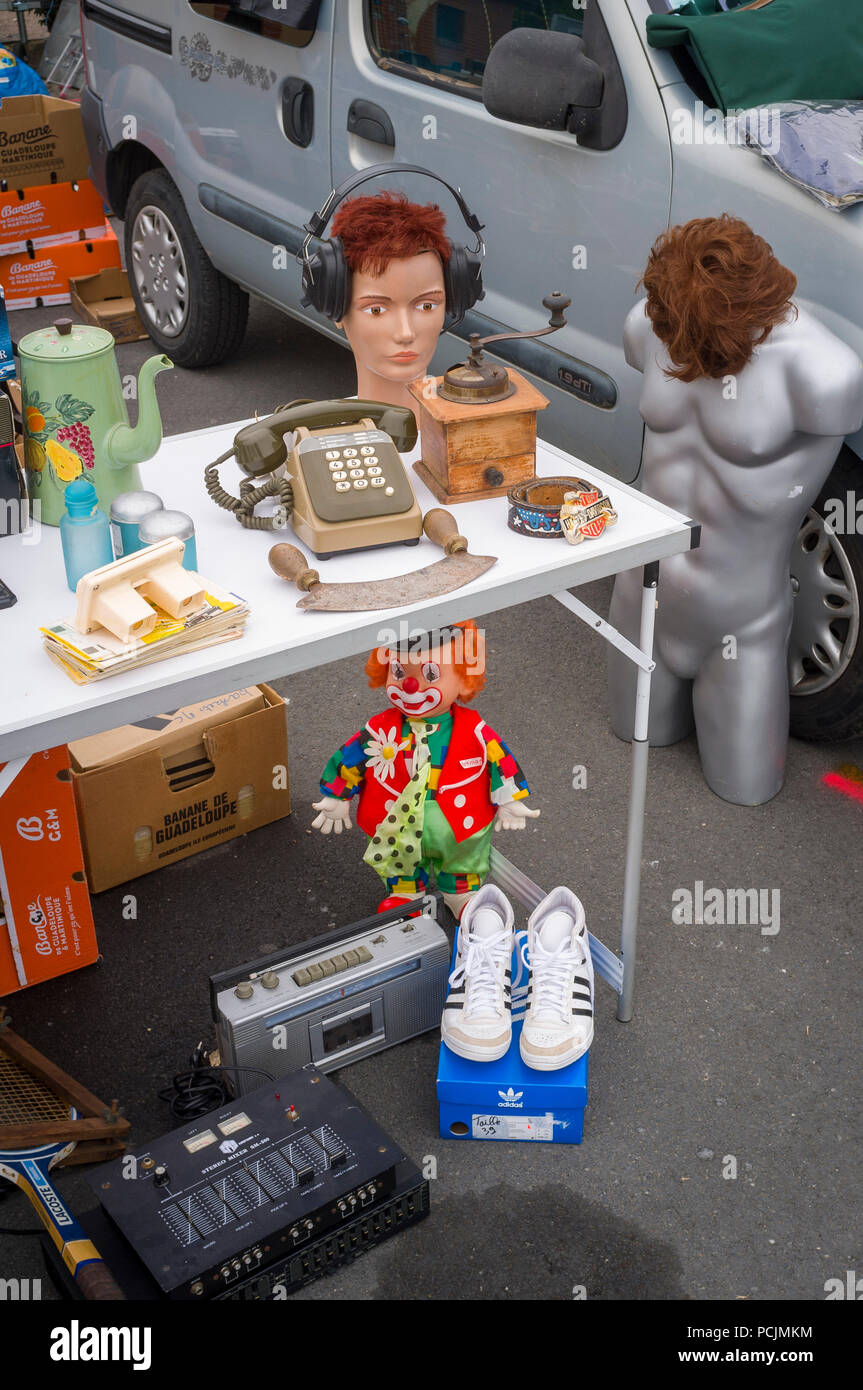 Items for sale at a boot sale or vide-grenier in the village of La Riviere St. Sauveur in Normandy, France, close to Honfleur Stock Photo