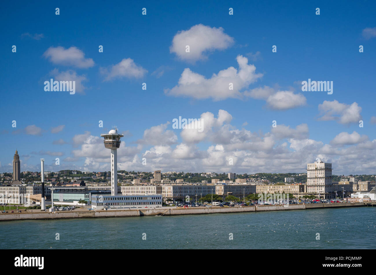 View of Le Havre from the sea showing the Musee Malraux and iconic apartments by Auguste Perret with blue sky and fluffy white cumulus clouds Stock Photo