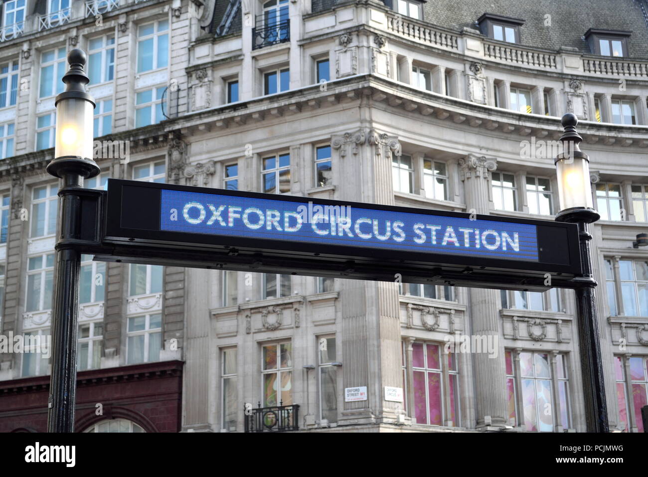 Oxford Circus Station sign at the junction of Regent Street and Oxford Street Stock Photo