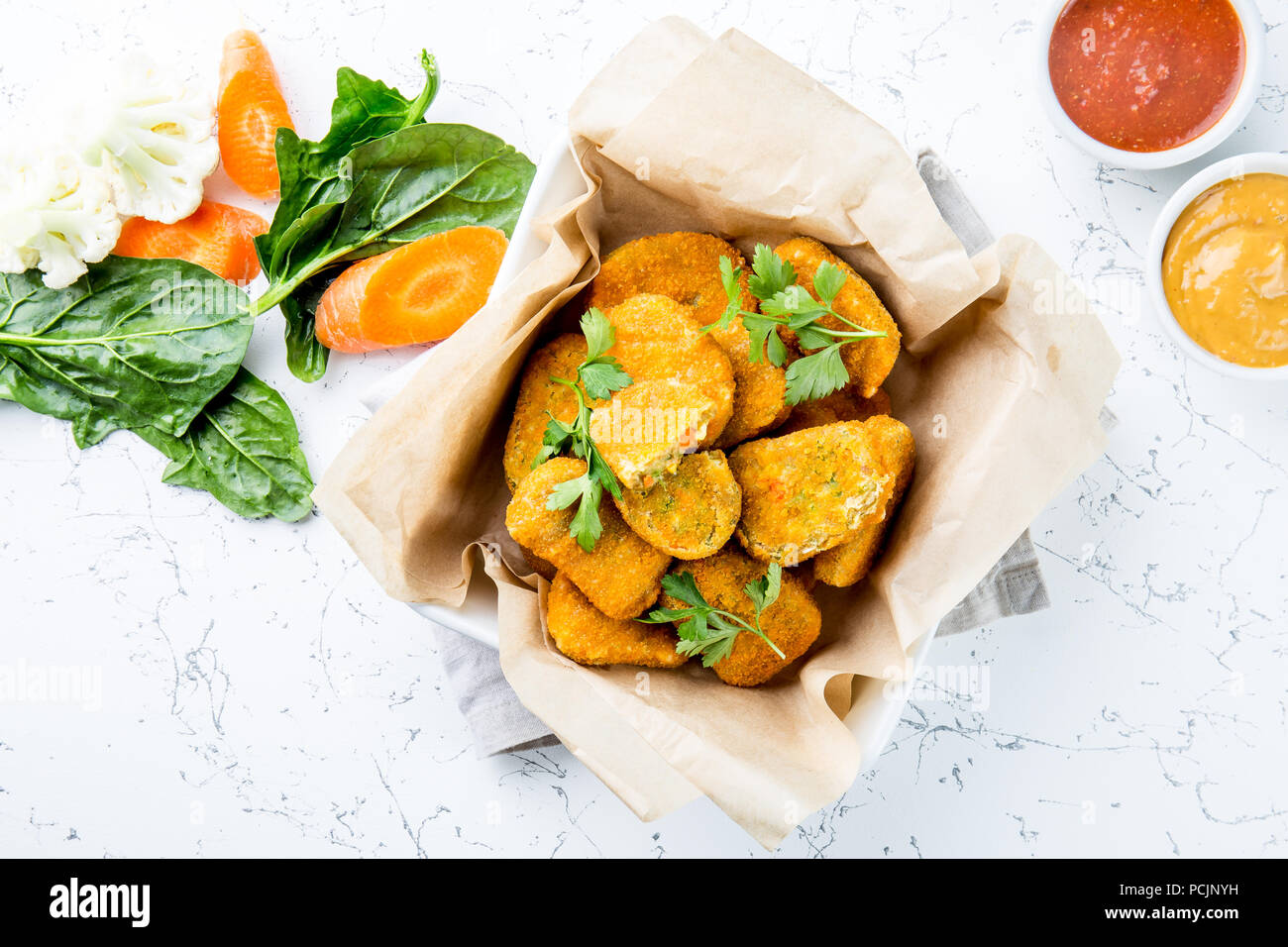 Healthy vegetarian nuggets with carrots, cauliflower and spinach