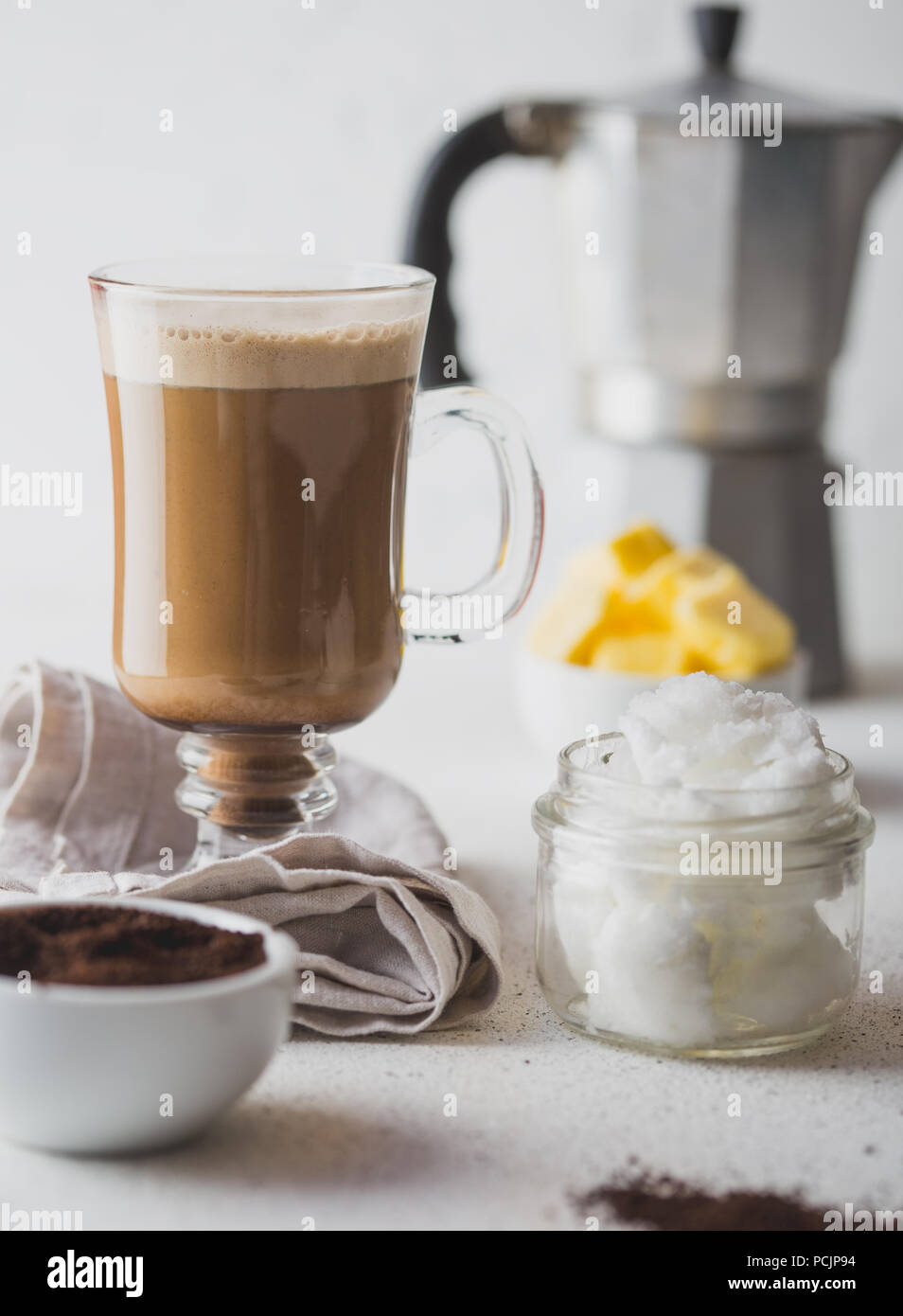 https://c8.alamy.com/comp/PCJP94/bulletproof-coffee-ketogenic-keto-diet-coffe-blended-with-coconut-oil-and-butter-cup-of-bulletproof-coffee-and-ingredients-on-white-background-PCJP94.jpg