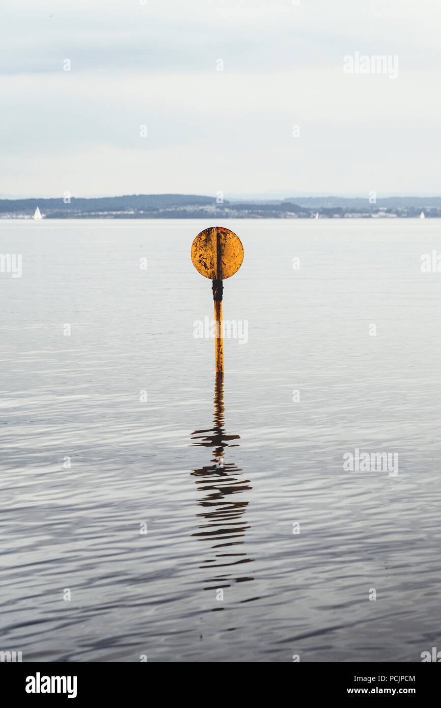A signal at the River Almond Estuary in the Firth of Forth by Cramond Beach marina. Edinburgh, Scotland, UK. Stock Photo