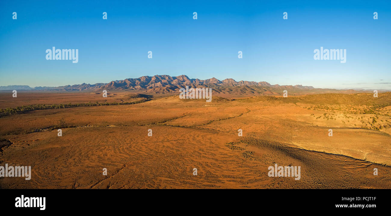 Aerial panorama of Flinders Ranges at orange sunset in South Australia ...