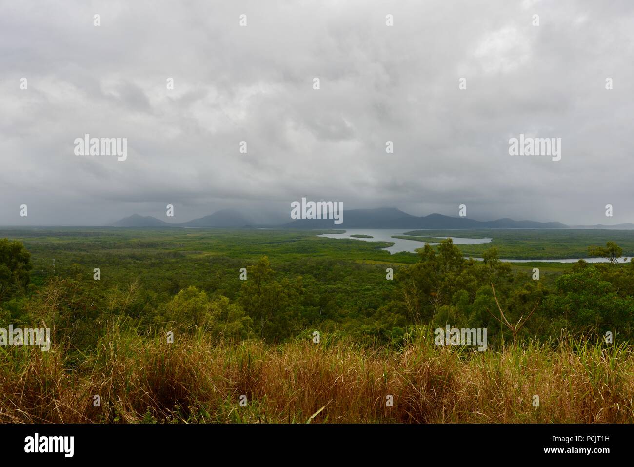 Hinchinbrook island on a cloudy misty day as seen from the Hinchinbrook