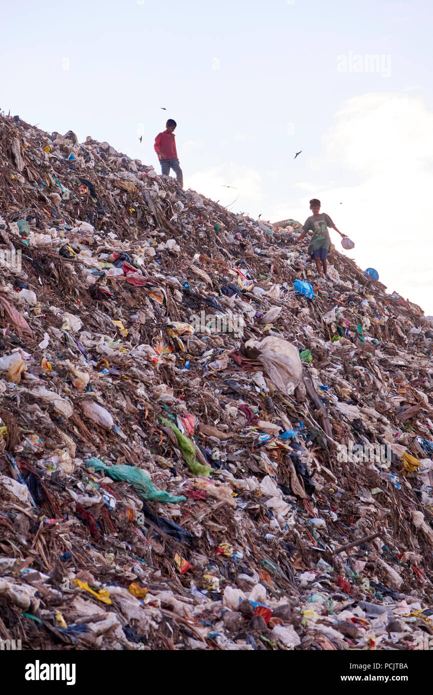 Rag pickers on rubbish tip Guwahati Assam India Stock Photo