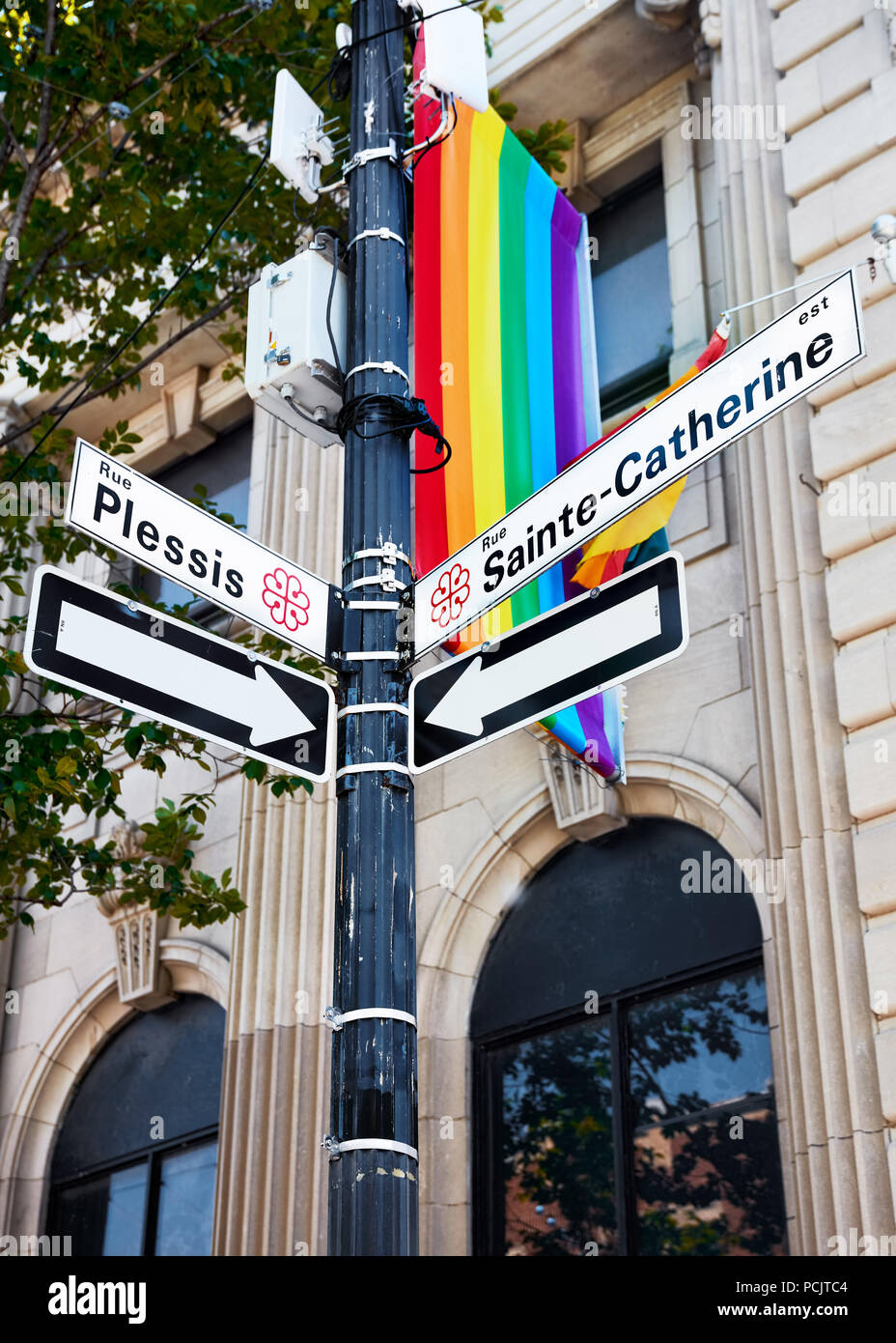Sainte Catherine and Rue Plessis street signs and a rainbow gay pride ...