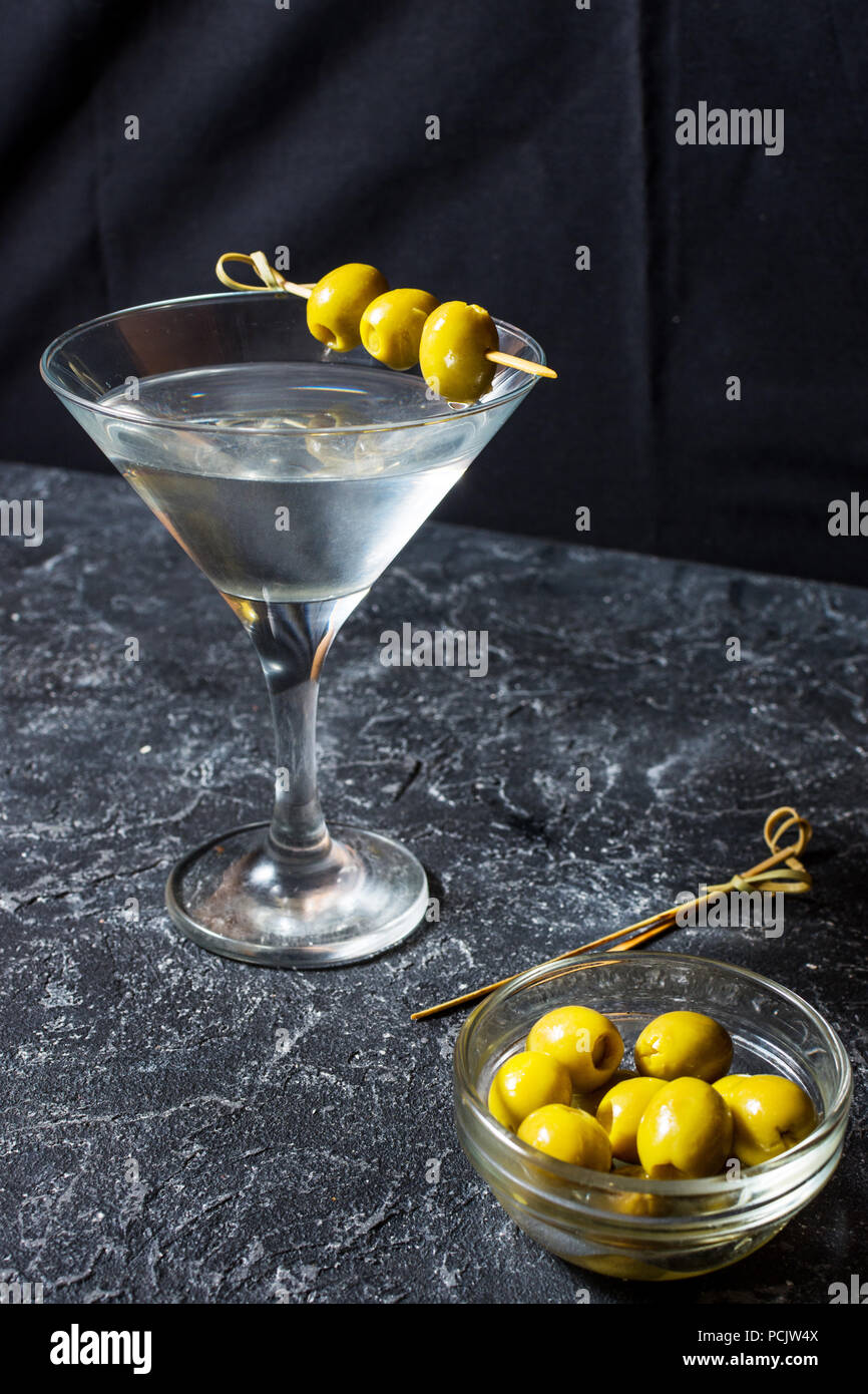 Martini Cocktail With Green Olives On Stone Table Background Stock 