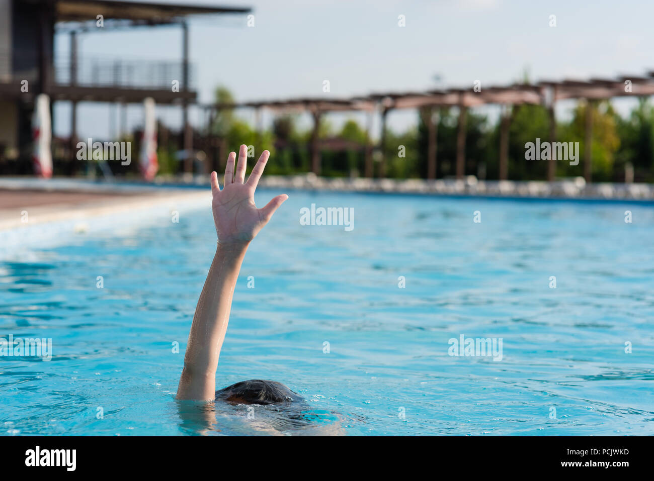 Hand up in swimming pool Stock Photo Alamy