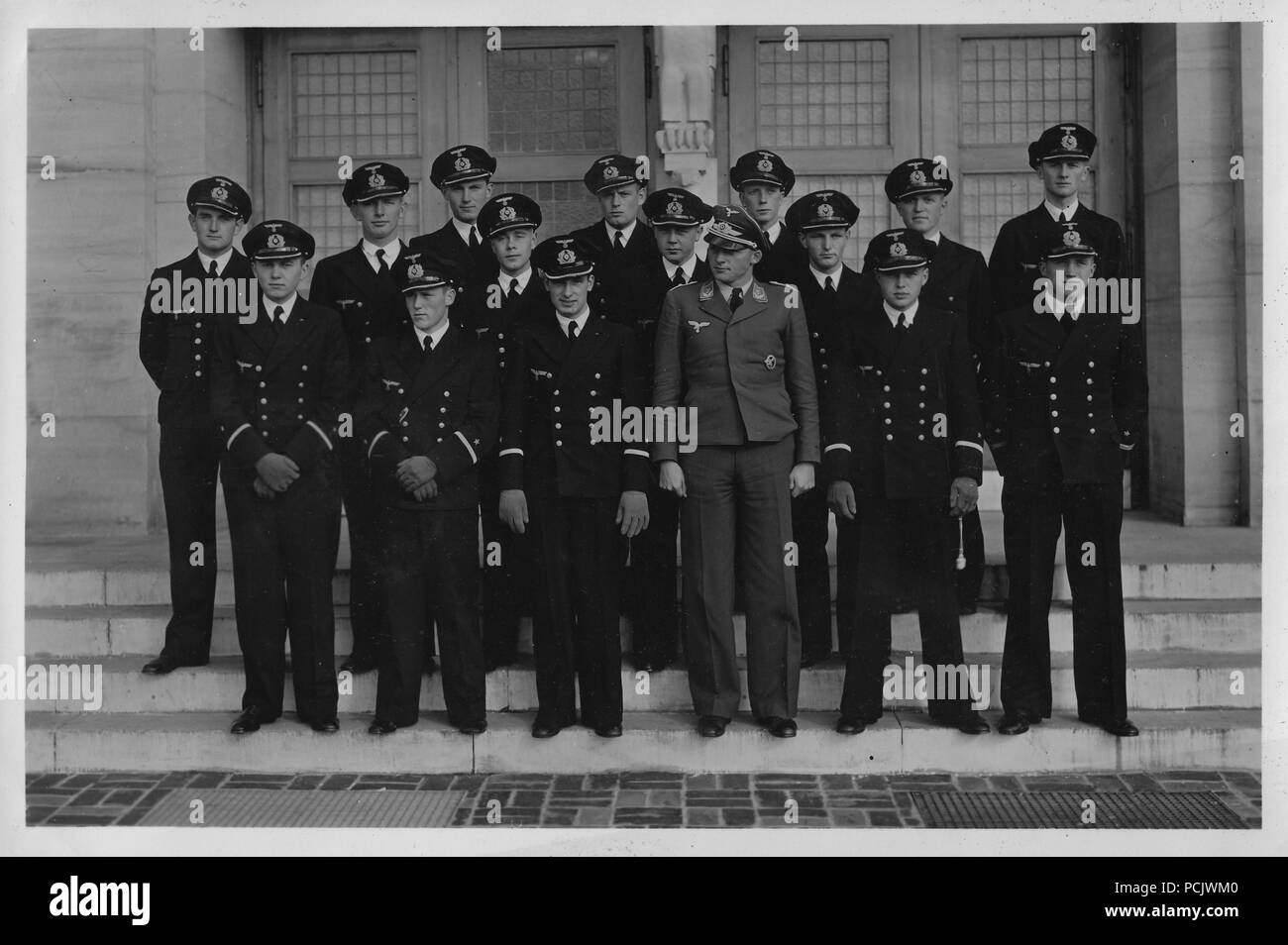 Image from the photo album of Oberleutnant Wilhelm Gaul: Luftwaffe Observer Oberleutnant Willi Gaul of 1. Staffel, Küstenfliegergruppe 106 (in Luftwaffe uniform) poses with officers of the Kriegsmarine outside the Officer's Mess at Château Haut Brian near Bordeaux. Stock Photo