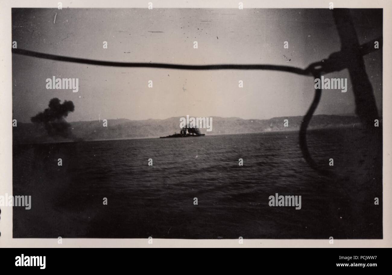 Image from the photo album of Oberfänrich Wilhelm Gaul - The German Heavy Cruiser Deutschland under air attack by Spanish Republican aircraft on 29 May 1937. Their bombs caused large fires on Deutschland, killed 31 sailors and wounded 74. Stock Photo
