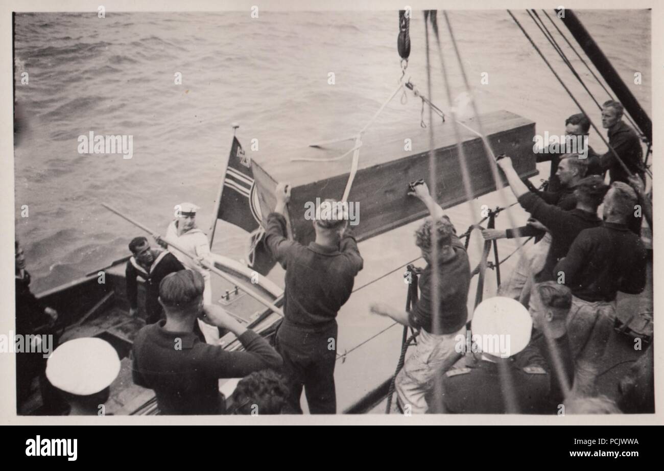 Image from the photo album of Oberfänrich Wilhelm Gaul - Coffins are taken on board Torpedo Boat Leopard from the German Cruiser Deutschland, following an air attack by Spanish Republican aircraft on 29 May 1937. Their bombs caused large fires on Deutschland, killed 31 sailors and wounded 74. Stock Photo