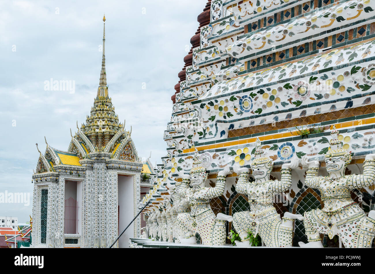 Wat Arun is  the most famous and photographed temple in Bangkok, which features a soaring 70m high spire decorated with colored glass and porcelain. Stock Photo