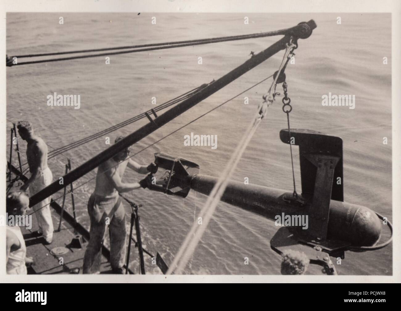 Image from the photo album of Oberfänrich Wilhelm Gaul - Deploying mine clearance equipment from German Torpedoboot Leopard (Torpedo Boat Leopard) in 1937, during the Spanish Civil War. Stock Photo