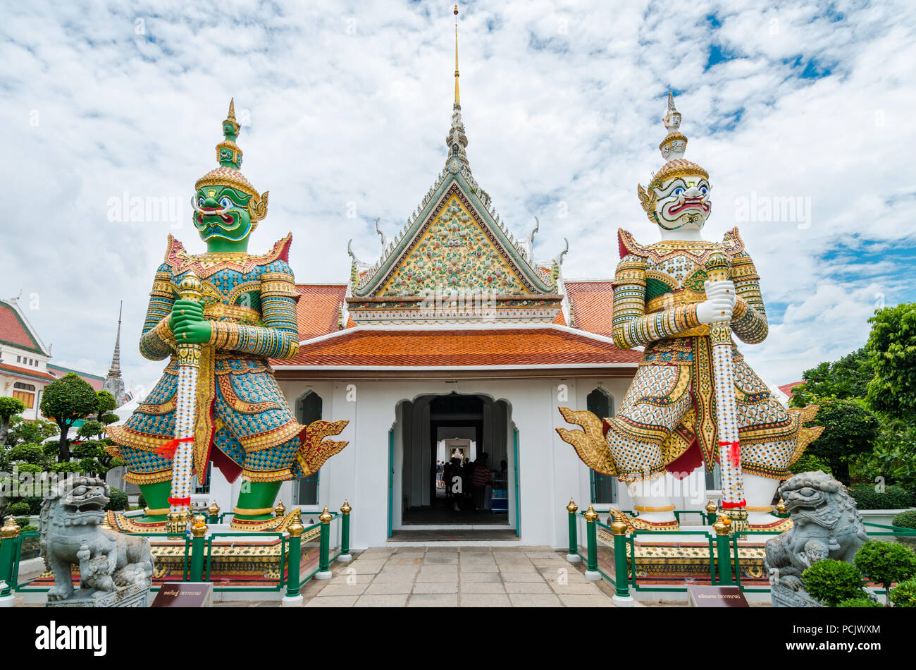 Demon Guardian of Wat Arun. Wat Arun is  the most famous and photographed temple in Bangkok, which features a soaring 70m high spire. Stock Photo