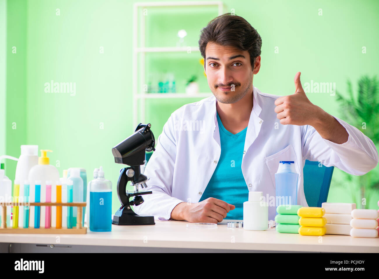 Chemist testing soap in hi-res stock photography and images - Alamy