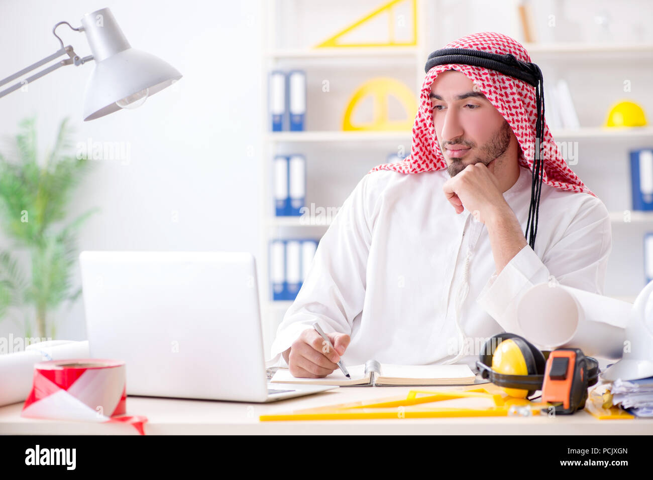 Arab engineer working on new project Stock Photo
