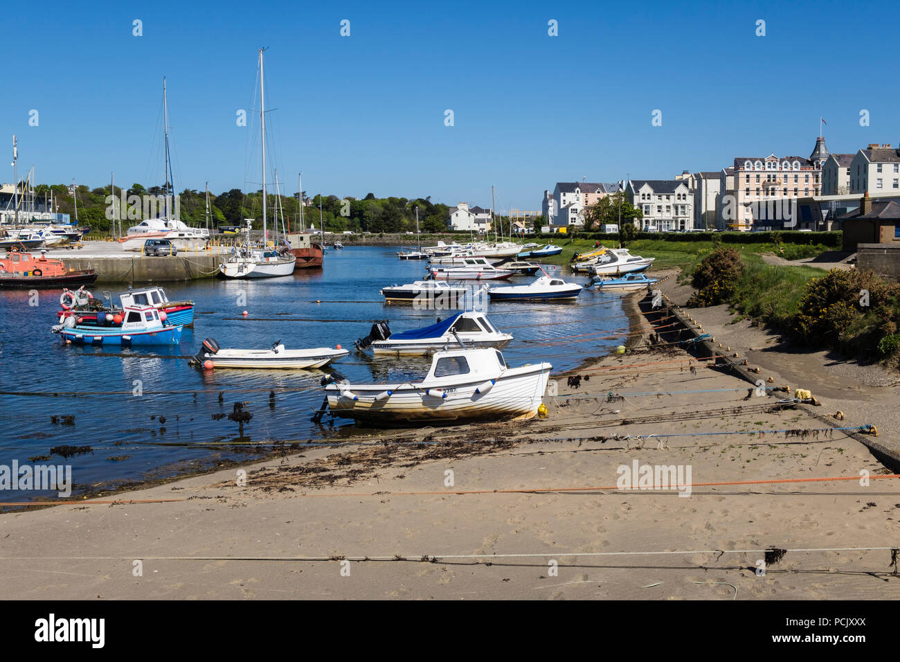Small boats moored in the inner harbour on Sulby River. Ramsey, Isle of Man, British Isles Stock Photo
