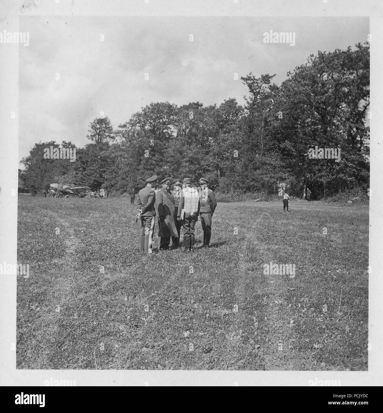 Image from a photo album relating to II. Gruppe, Jagdgeschwader 3: Feldmarschall Albert Kesselring in discussion with Hauptmann Erich von Selle and other officers of II./JG3 at Wierre-au-Bois airfield in France, summer 1940. In the background is one of the units Messerschmitt Bf 110 heavy fighters. Stock Photo