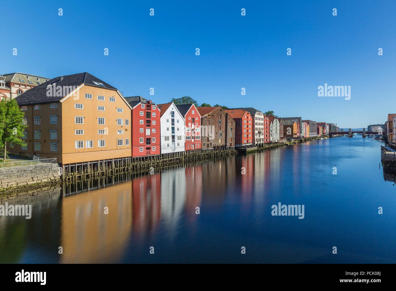 Colorful old storehouses along the river Nidelva in Trondheim Stock Photo