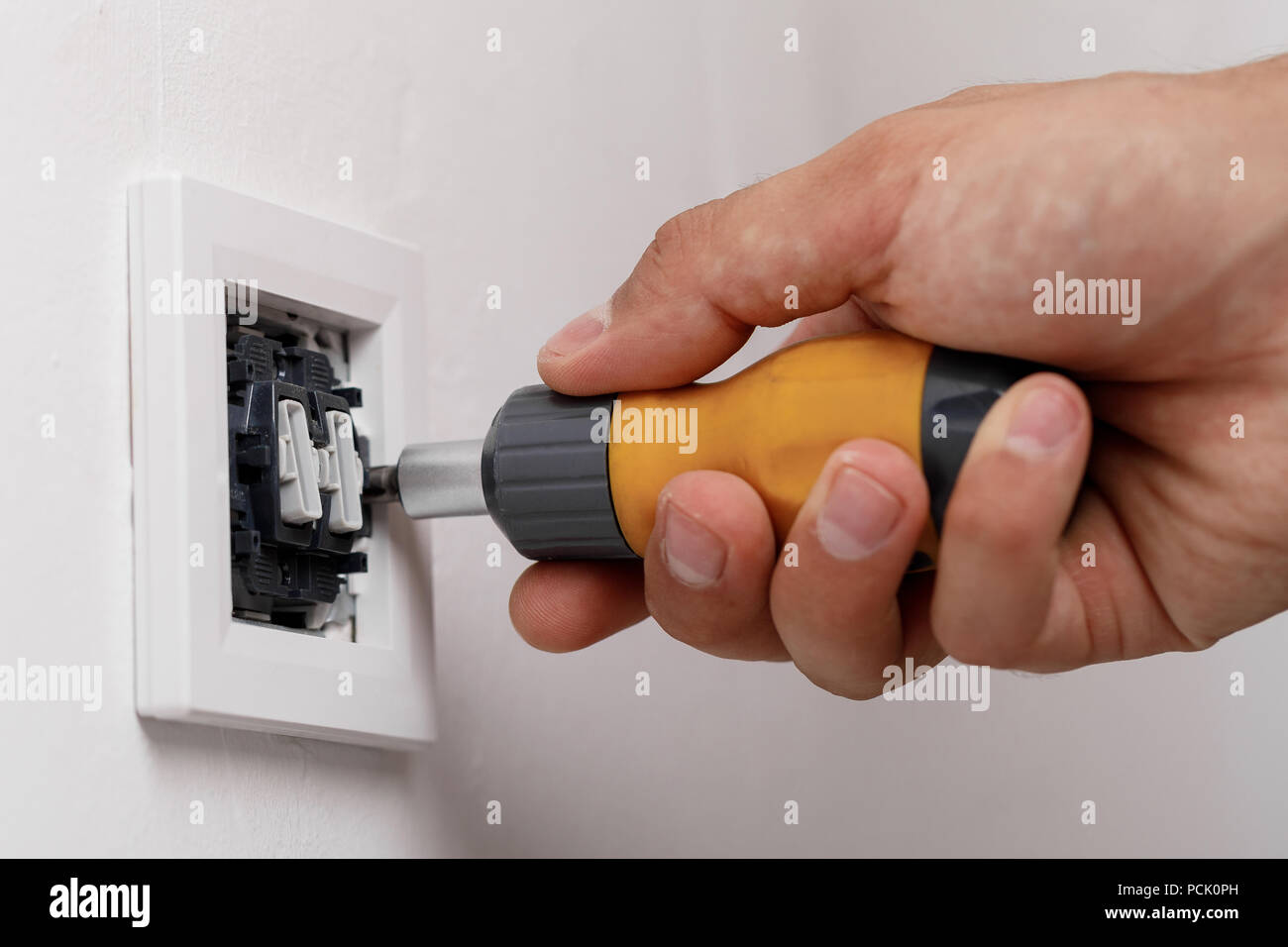 electrician installing light switch Stock Photo Alamy