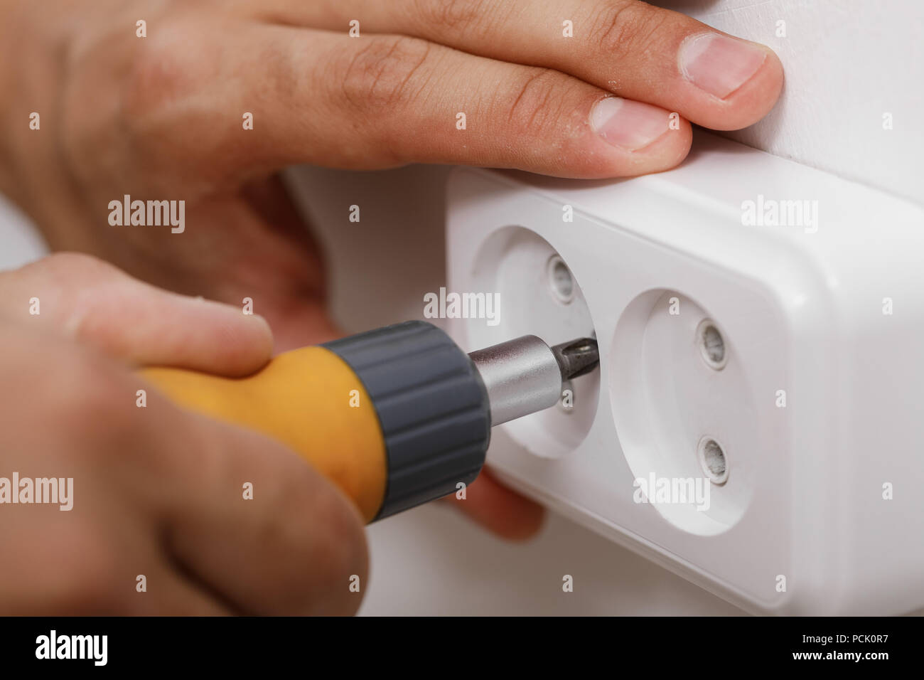 electrician installing electrical socket Stock Photo Alamy