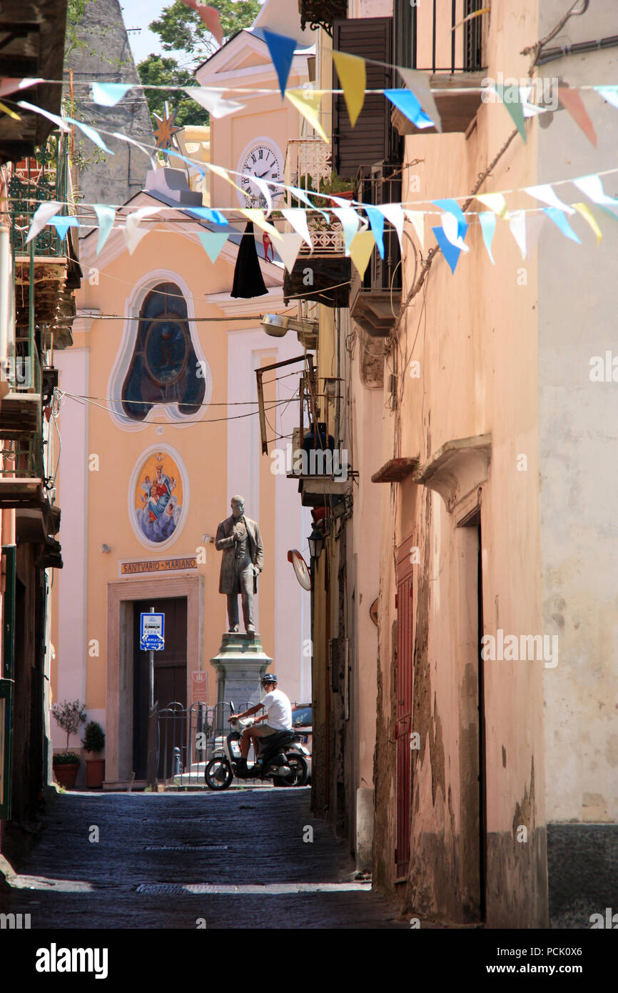 Narrow alley leading to the Piazza dei Matiri and the Santuario S. Maria delle Grazie Incoronata on Procida, Golfo di Napoli, Italy Stock Photo