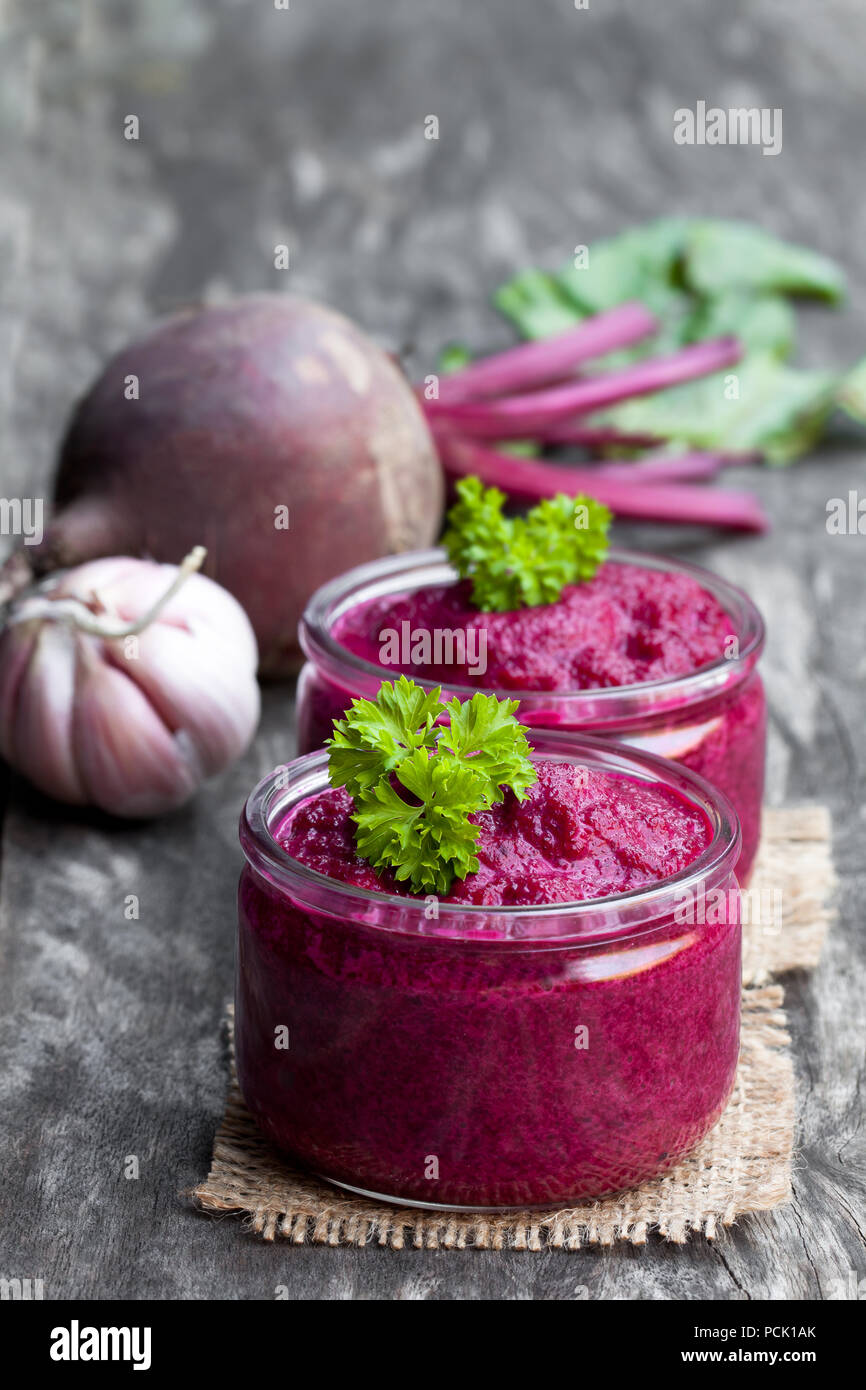 Beetroot puree in glass jars on wooden table Stock Photo - Alamy