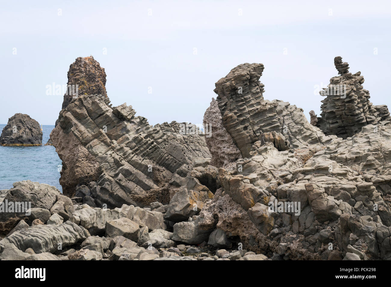 Italy Sicily Catania Aci Trezza Faraglioni basalt rocks the Isole dei Ciclopt nature reserve of Homer fame Stock Photo