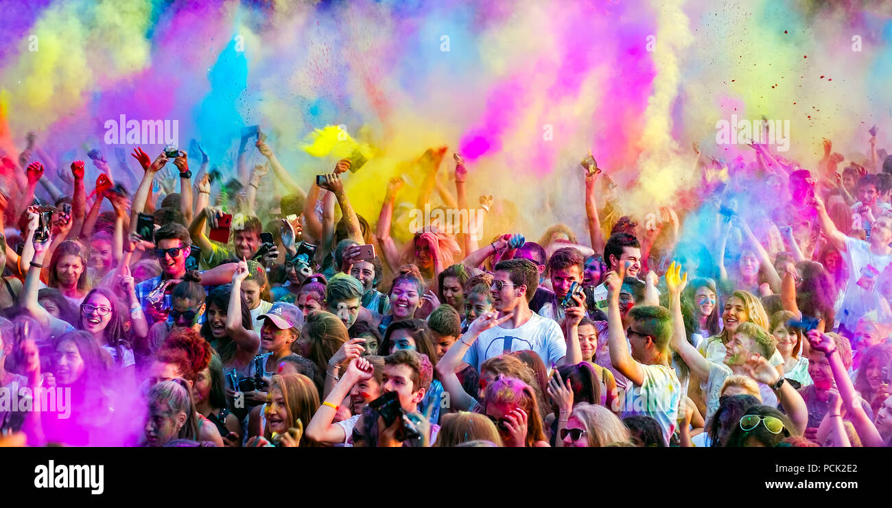 Happy young people dancing and celebrating during Music and Colors festival Stock Photo