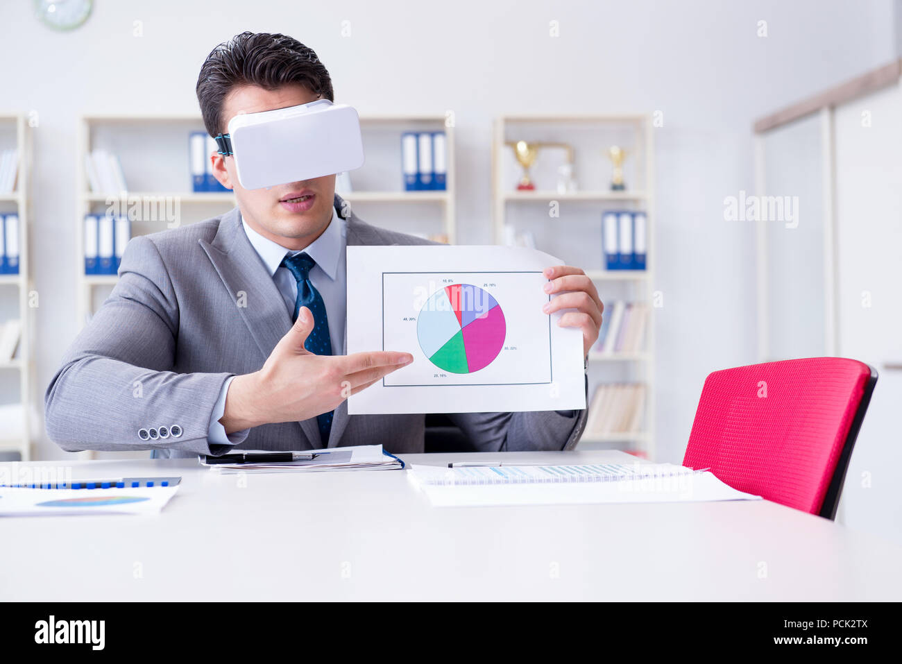Businessman with virtual reality glasses in the office Stock Photo - Alamy