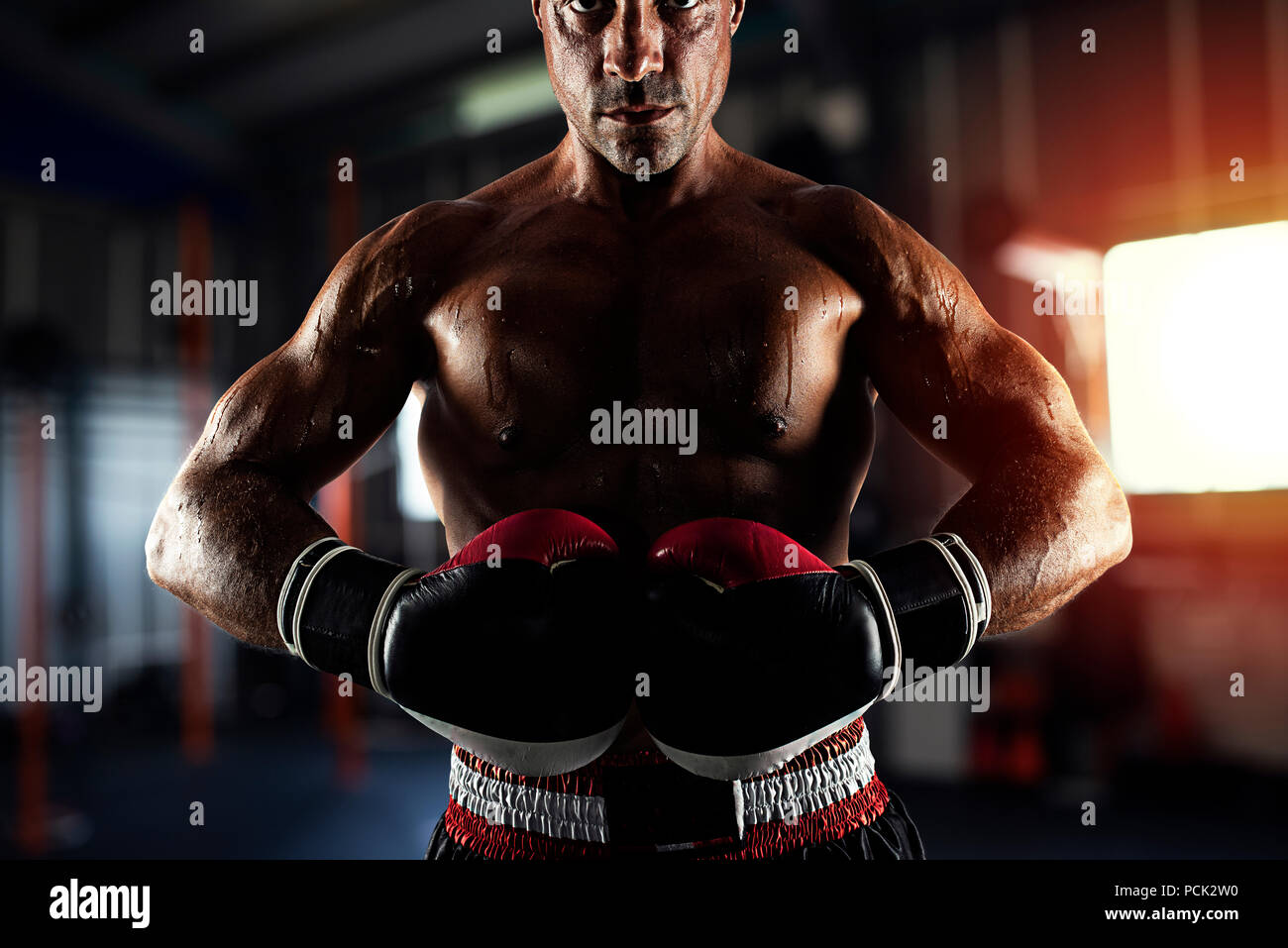 Boxer ready to fight at the gym Stock Photo